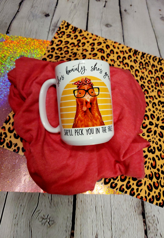 She's beauty she's grace she will peck you in the face mug